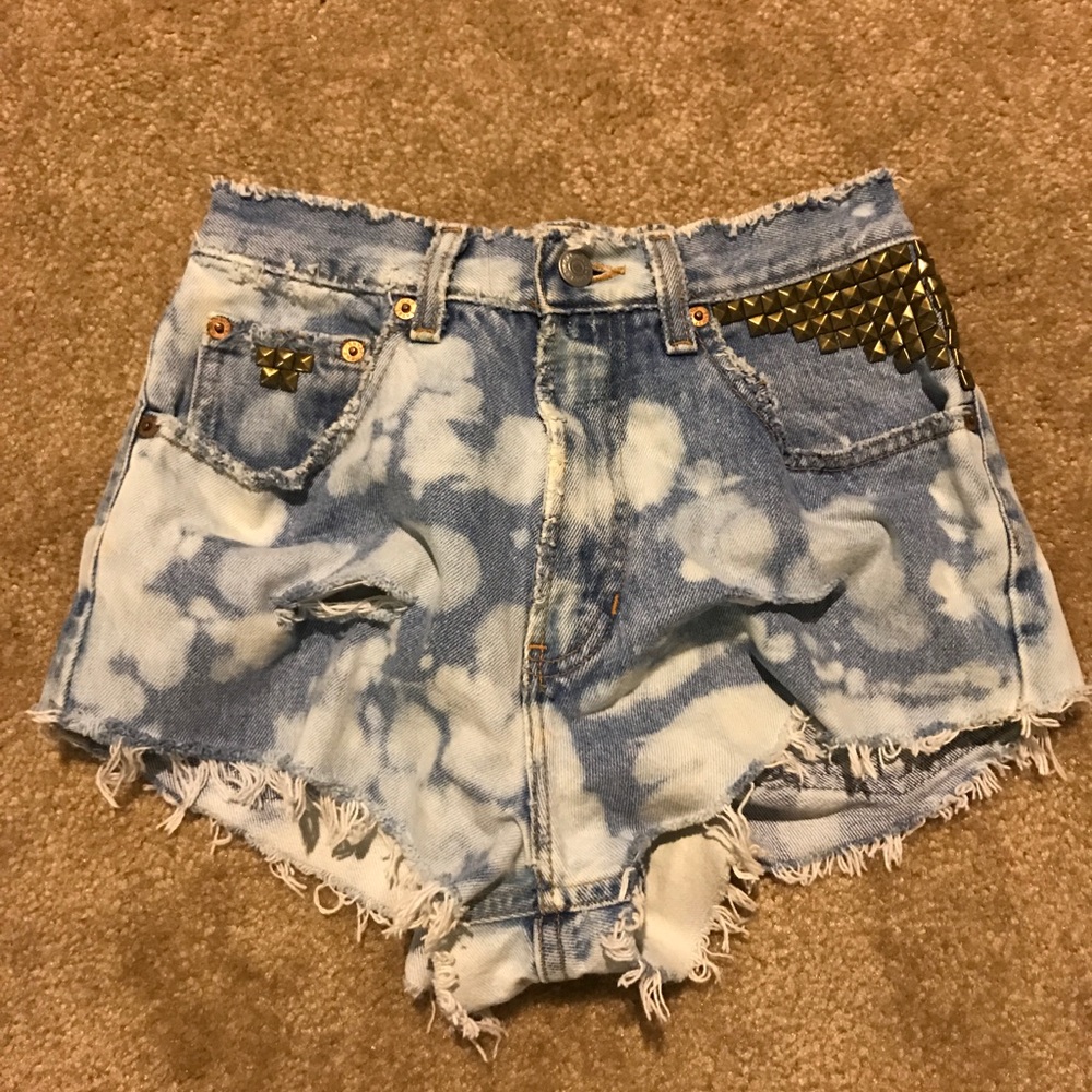 Distressed studded denim shorts